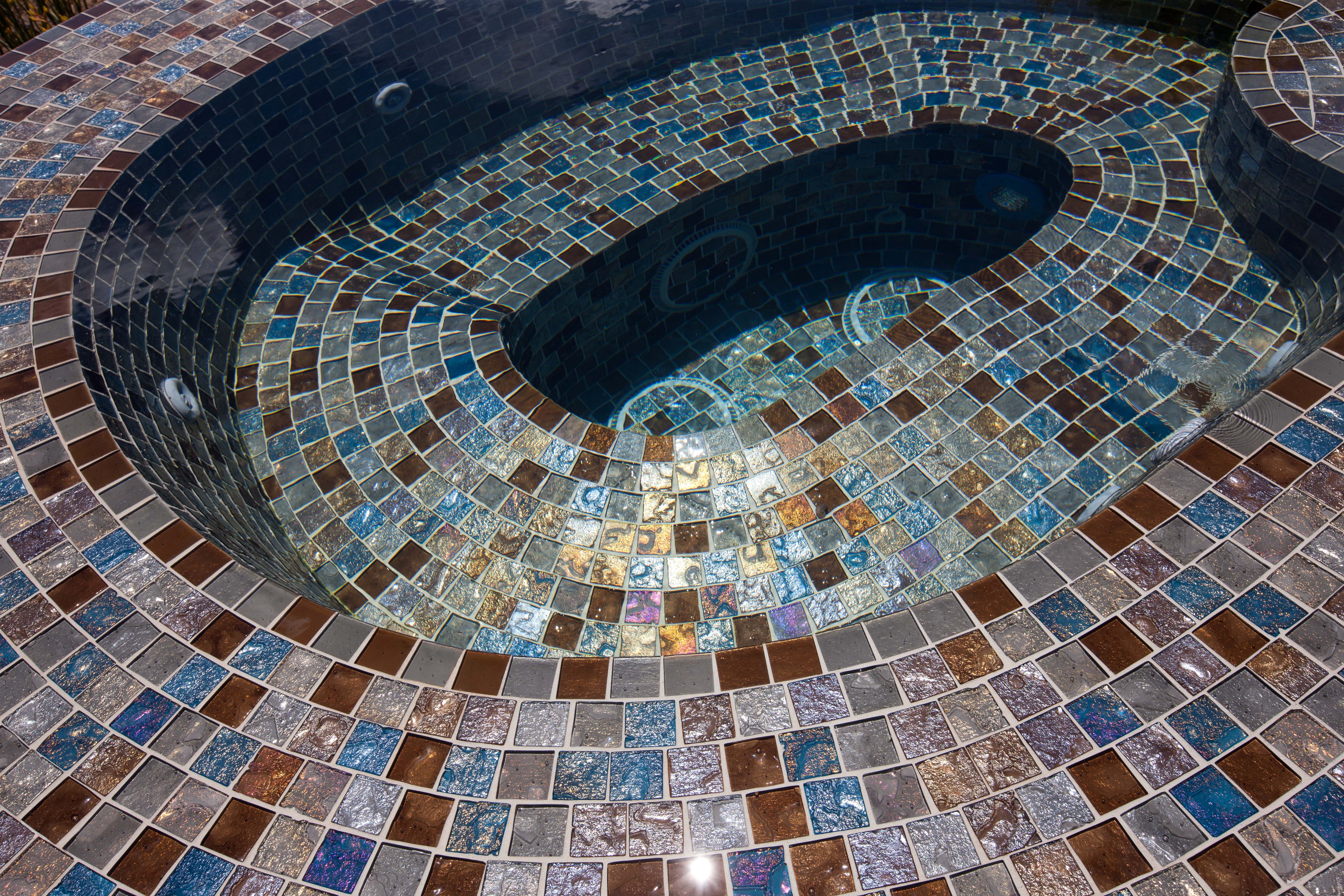 Curved glass tile spa step